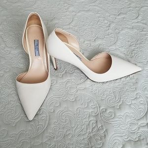 White Prada patent leather pumps